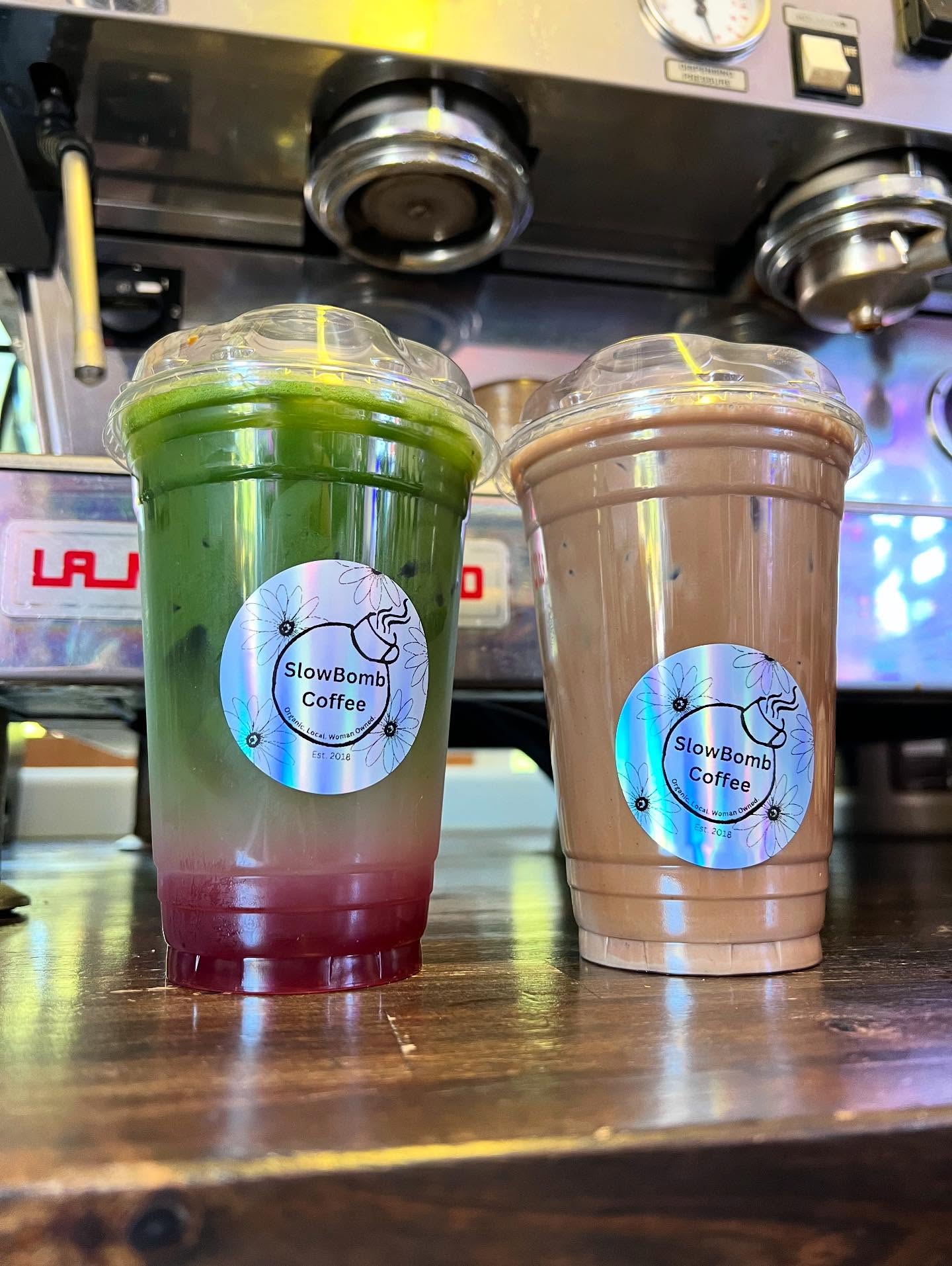 Hot pink Slowbomb specialty latte with whipped cream topping